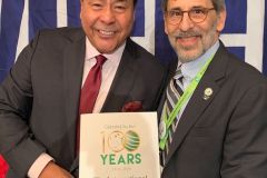 Dr. Dov Sydney (ICD) and John Quinones with ICD Centennial Poster